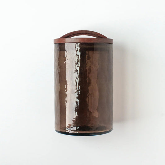Brown glass canister with wooden lid.