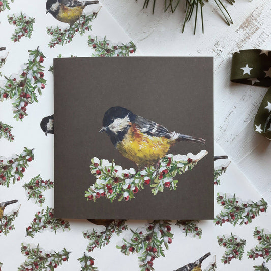 Christmas gift card with a bird watercolour on matching Christmas wrapping paper.