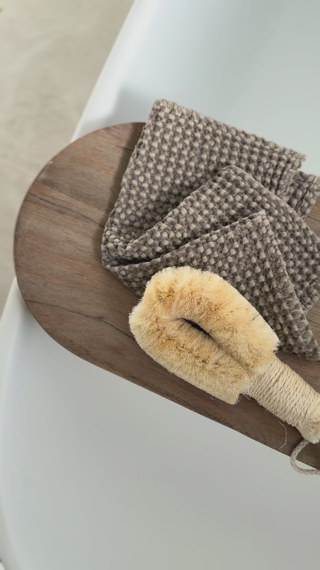 Timber bath caddy with bathtime essentials.